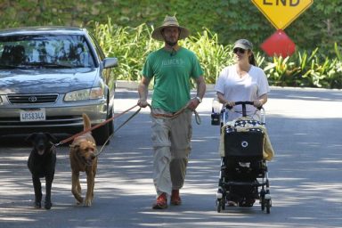 Tiffani Thiessen White Tshirt, baby stroller, hat, sunglasses, dogs